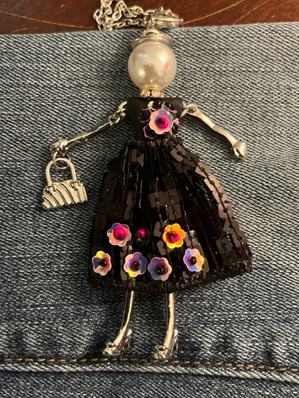 Coco + Carmen Black Doll Pendant Necklace with Pink & Purple Flower Accents